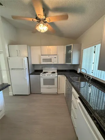 a view of room with white door and door