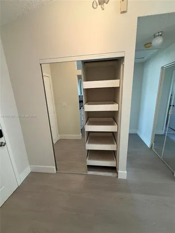 a view of a room with racks on the wall