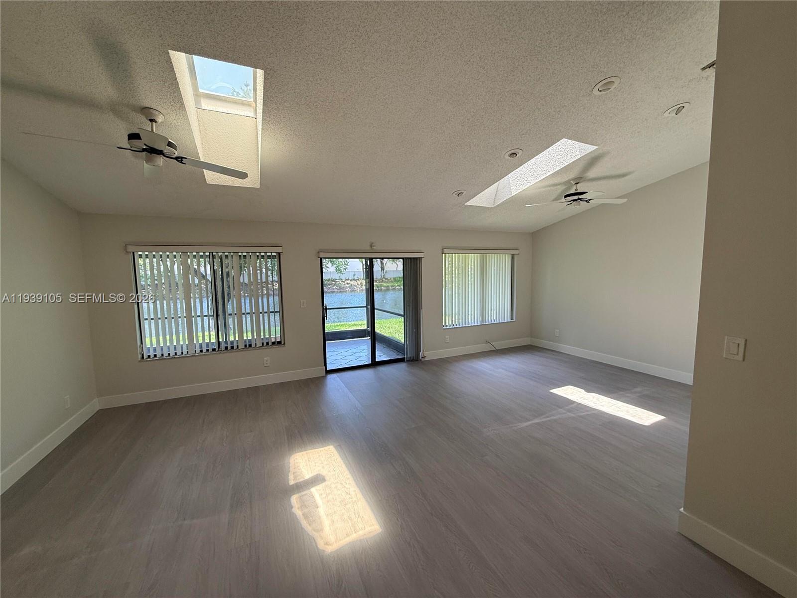 7808 Northwest 60th Street Tamarac, FL 33321 - Photo 17 of 26 a view of empty room with windows