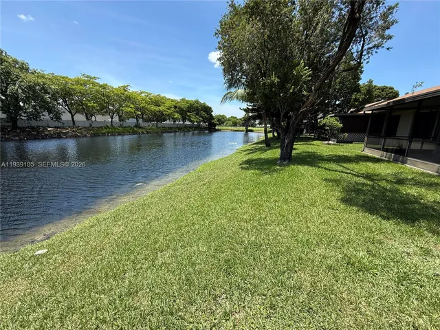 a view of a lake with a yard