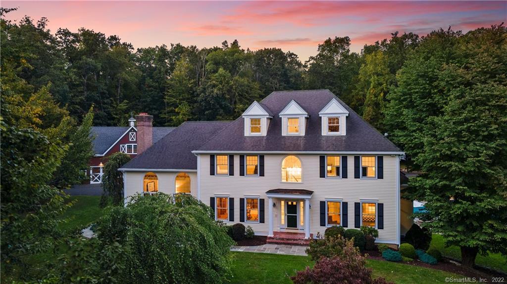 546 High Ridge Road Southbury, CT 06488 - Photo 1 of 1 a front view of a house with a yard and trees in the background
