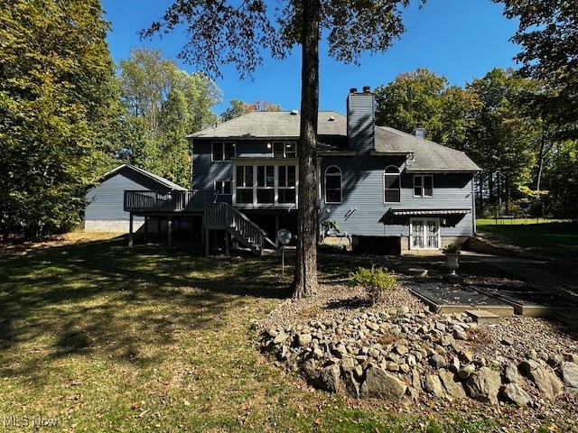 12470 Caves Road Chesterland, OH 44026 - Photo 4 of 24 Rear view of property with stairs, a chimney, a wooden deck, and a yard