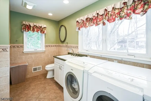 a bathroom with a sink a mirror and a bathtub