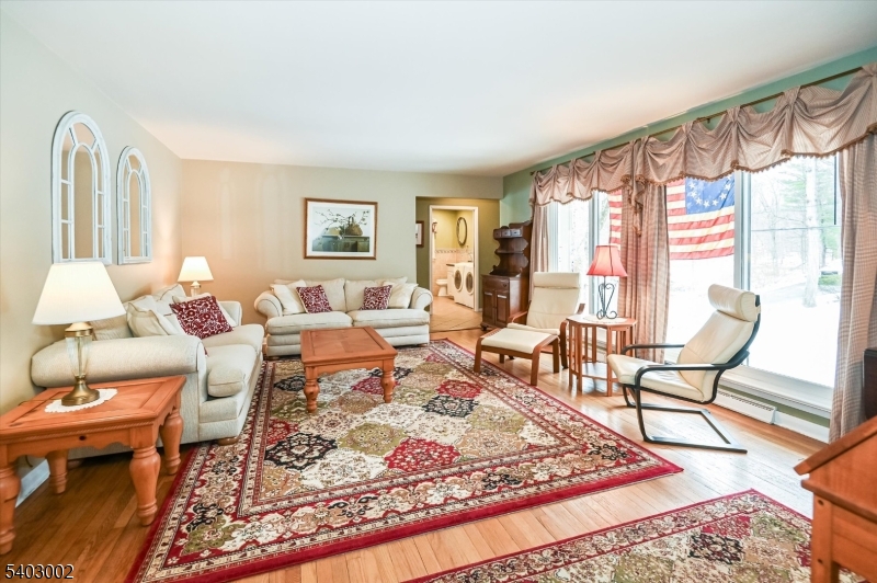 45 Indian Road Wayne, NJ 07470 - Photo 4 of 30 a living room with furniture and a rug