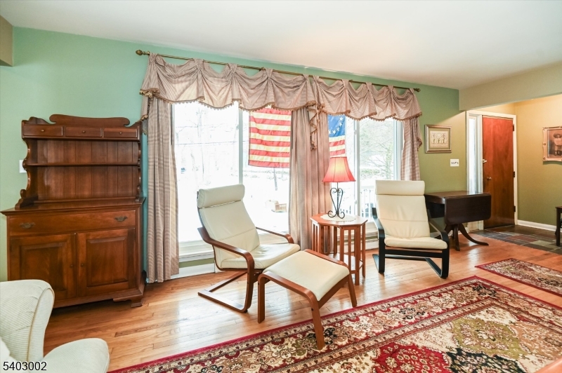45 Indian Road Wayne, NJ 07470 - Photo 6 of 30 a living room with furniture a rug and a window
