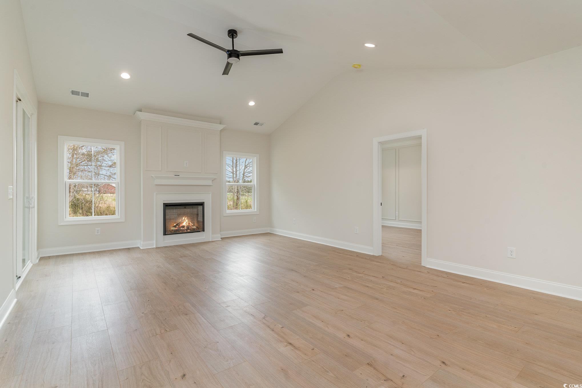 4010 Macks Road Aynor, SC 29511 - Photo 8 of 27 Unfurnished living room with vaulted ceiling, ligh