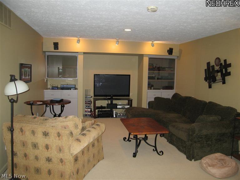 16712 Woodleaf Road Strongsville, OH 44136 - Photo 10 of 21 Kitchen opens to a pleasant family area. Wood burning fireplace and built-ins with plenty of room for the big screen.