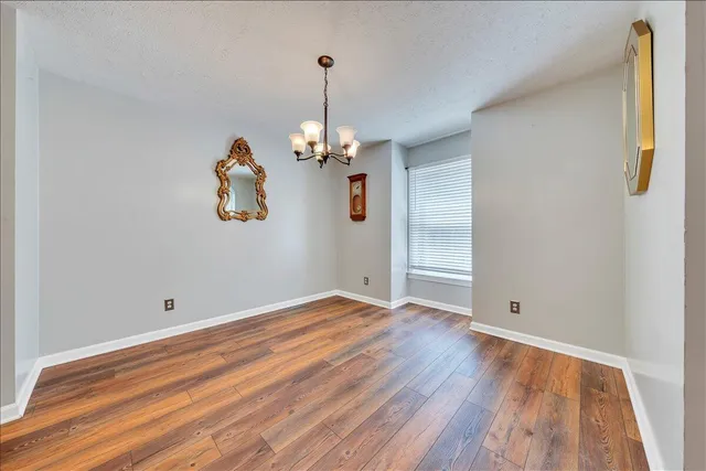 wooden floor in a hall with window