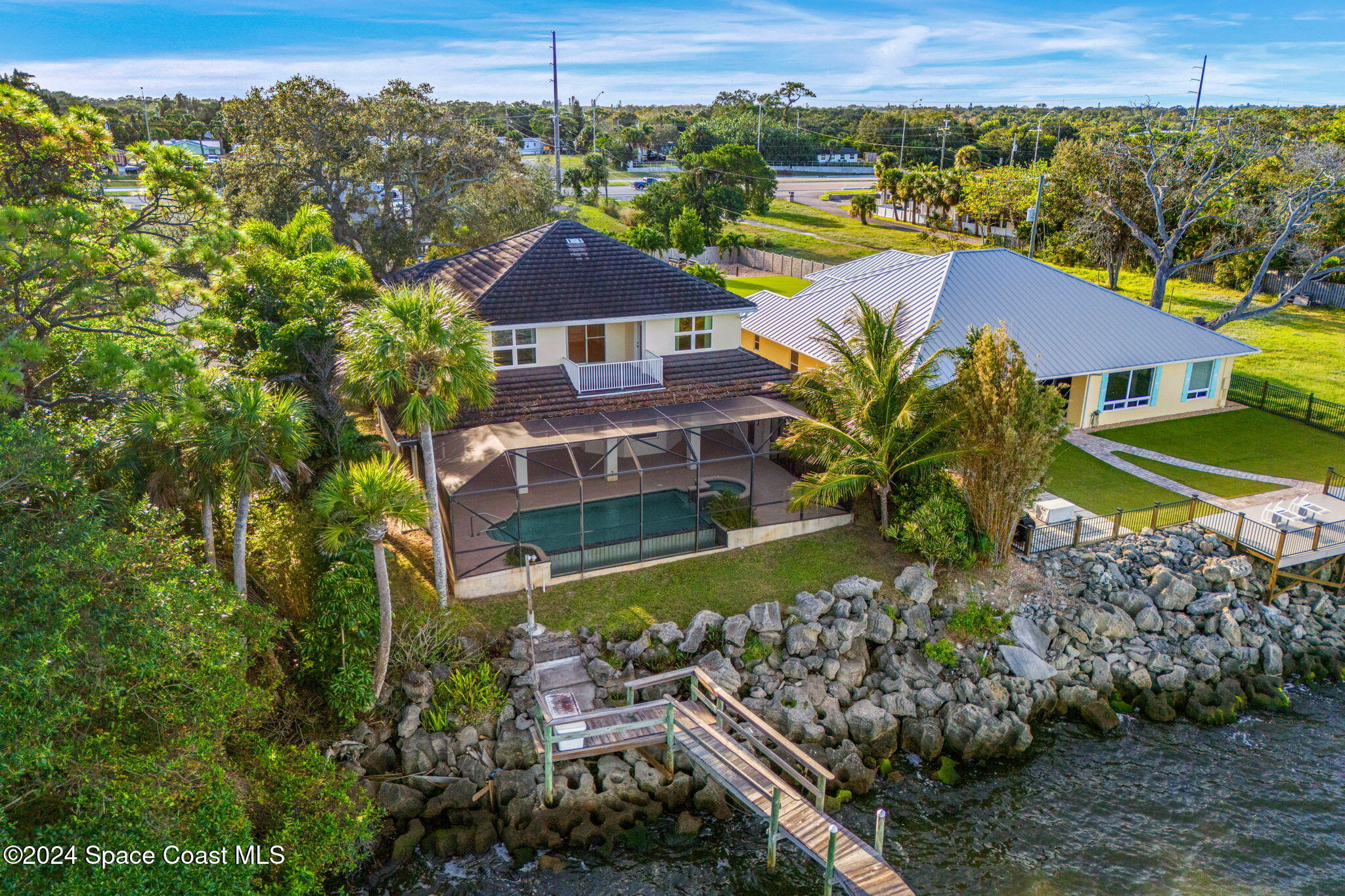 an aerial view of a house with a garden