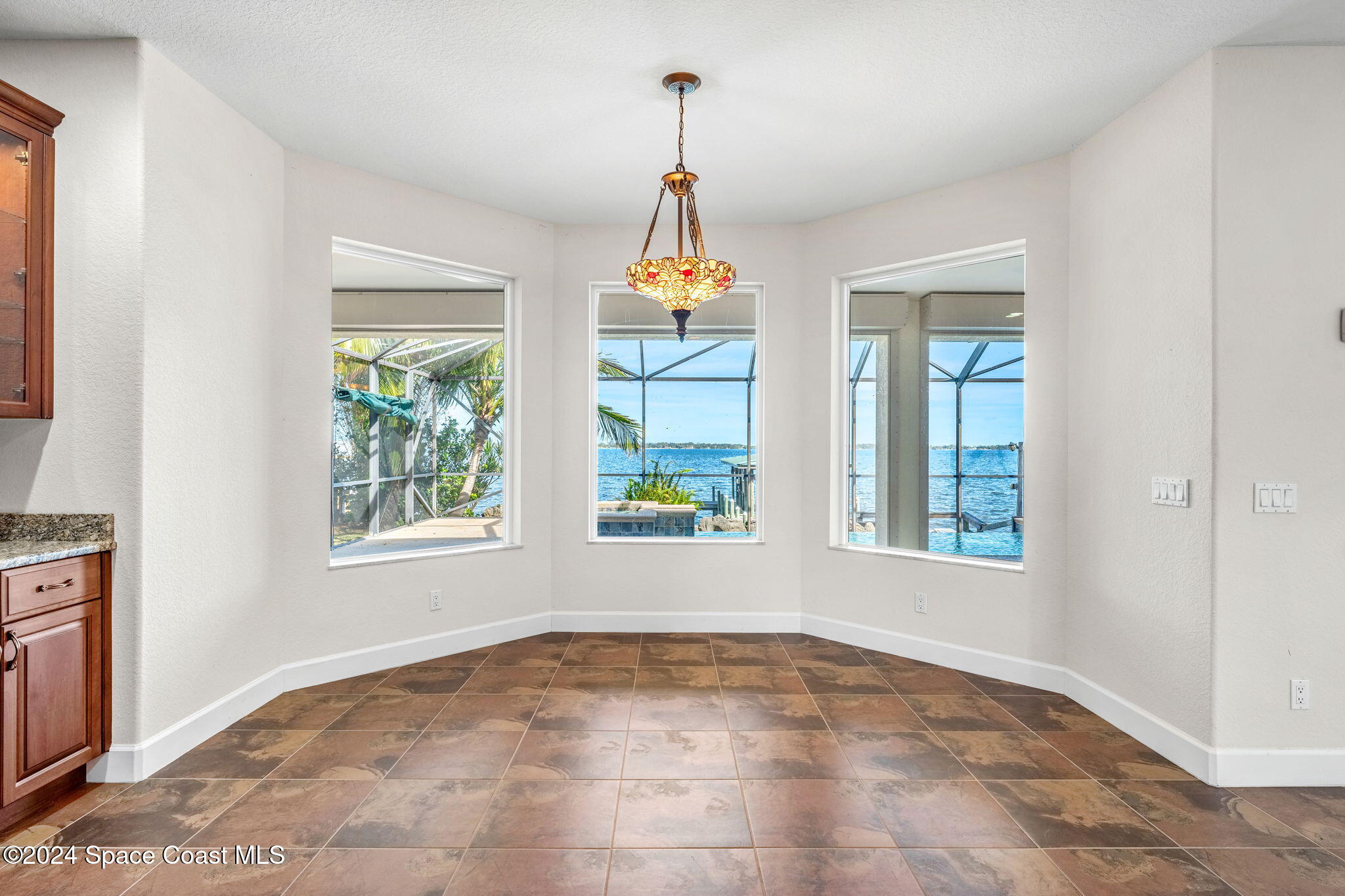 1600 Elm Drive West Melbourne, FL 32935 - Photo 13 of 79 an empty room with windows and entrance