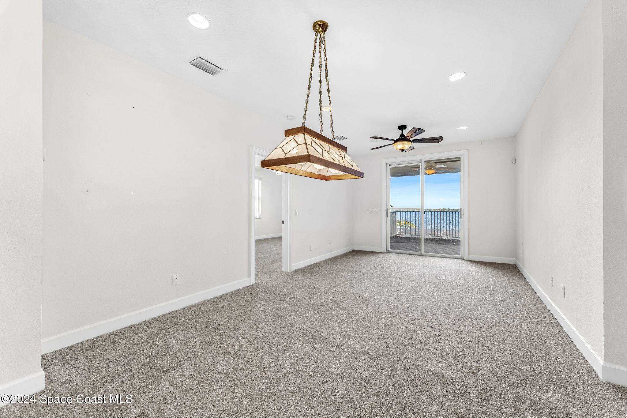 1600 Elm Drive West Melbourne, FL 32935 - Photo 15 of 79 an empty room with windows and ceiling fan
