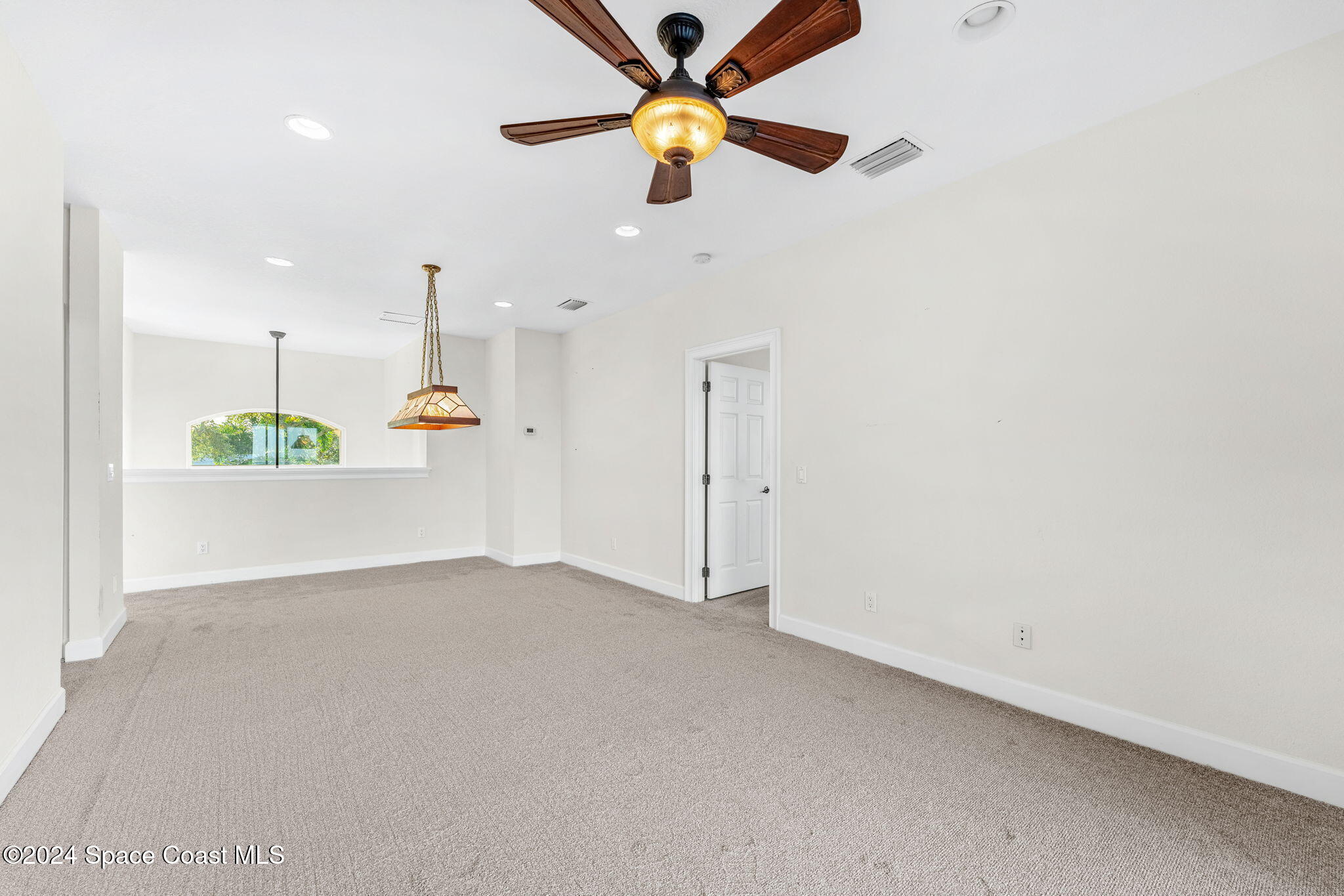 1600 Elm Drive West Melbourne, FL 32935 - Photo 16 of 79 an empty room with a ceiling fan and a window