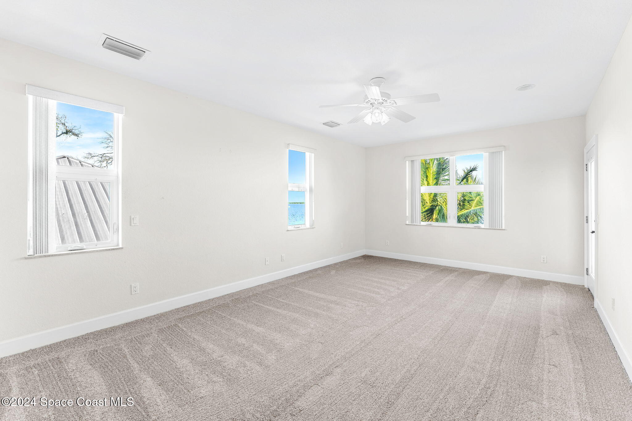 1600 Elm Drive West Melbourne, FL 32935 - Photo 23 of 79 wooden floor in an empty room with a window