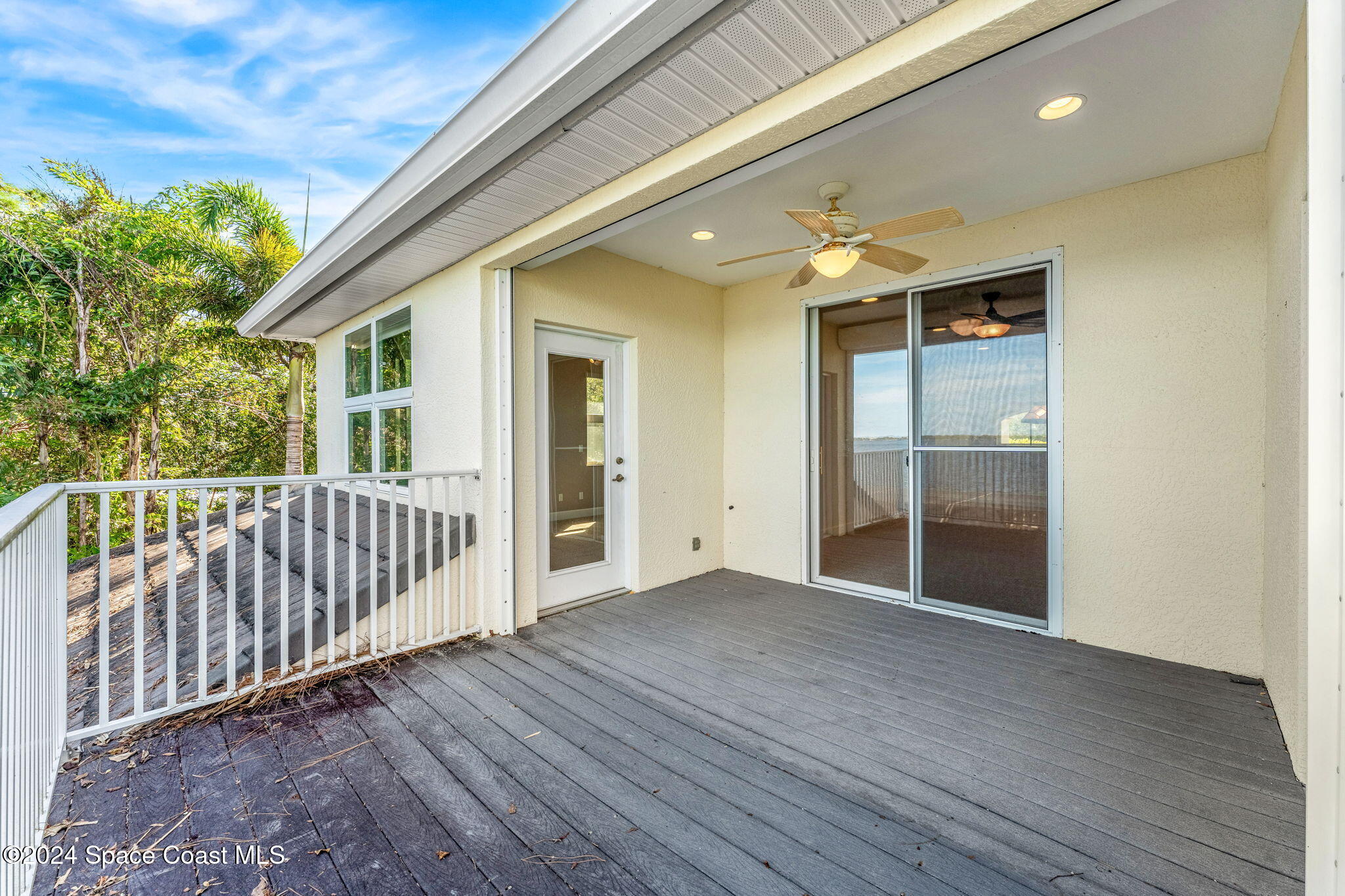 1600 Elm Drive West Melbourne, FL 32935 - Photo 26 of 79 a view of a porch with wooden floor and fence
