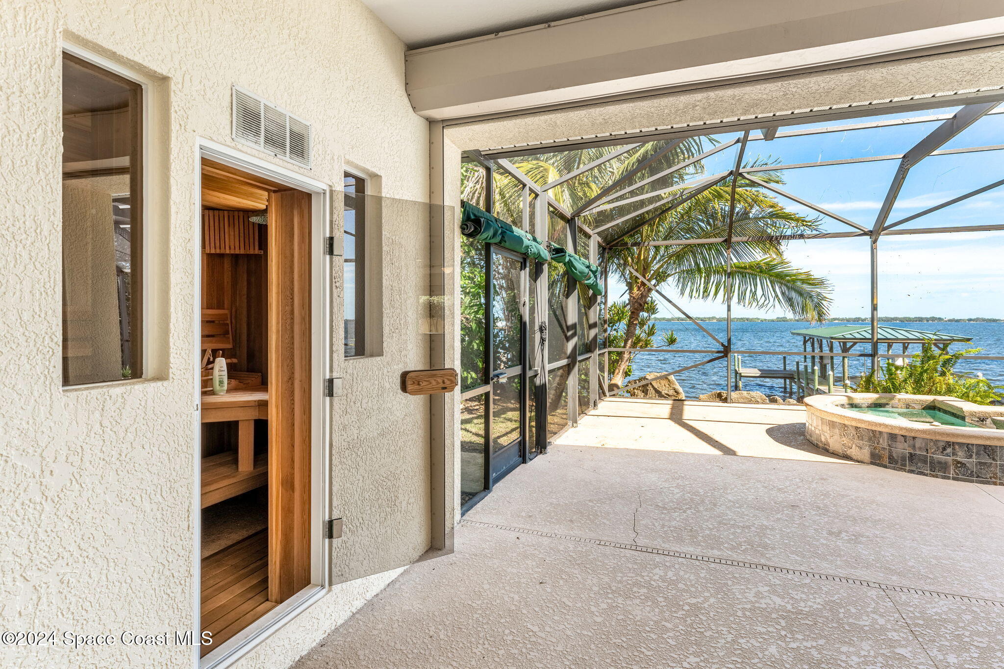 1600 Elm Drive West Melbourne, FL 32935 - Photo 38 of 79 a view of a porch with a table and chairs under an umbrella