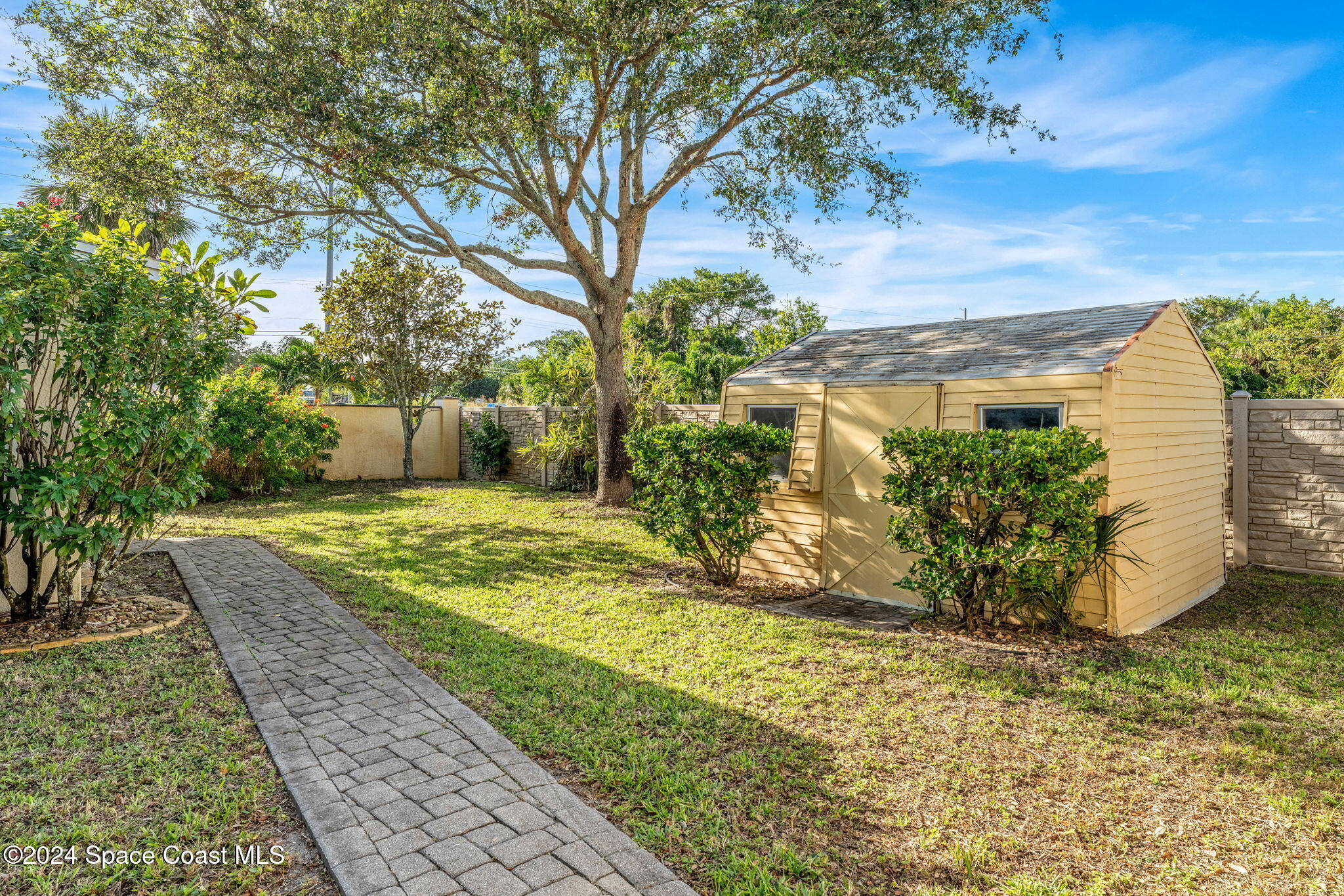1600 Elm Drive West Melbourne, FL 32935 - Photo 48 of 79 a view of a yard with plants and a fountain