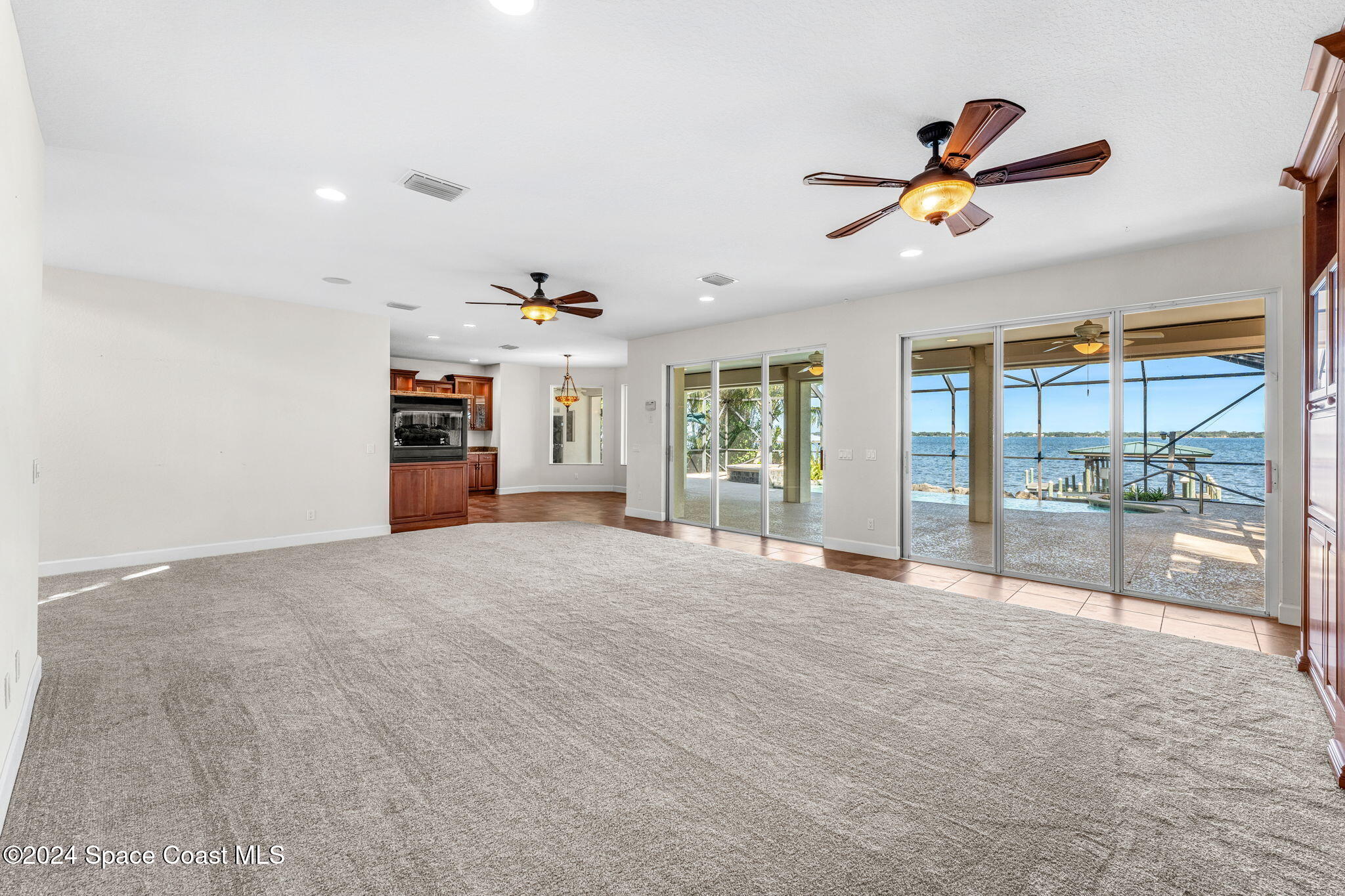 1600 Elm Drive West Melbourne, FL 32935 - Photo 5 of 79 a view of empty room with cabinet and floor to ceiling window