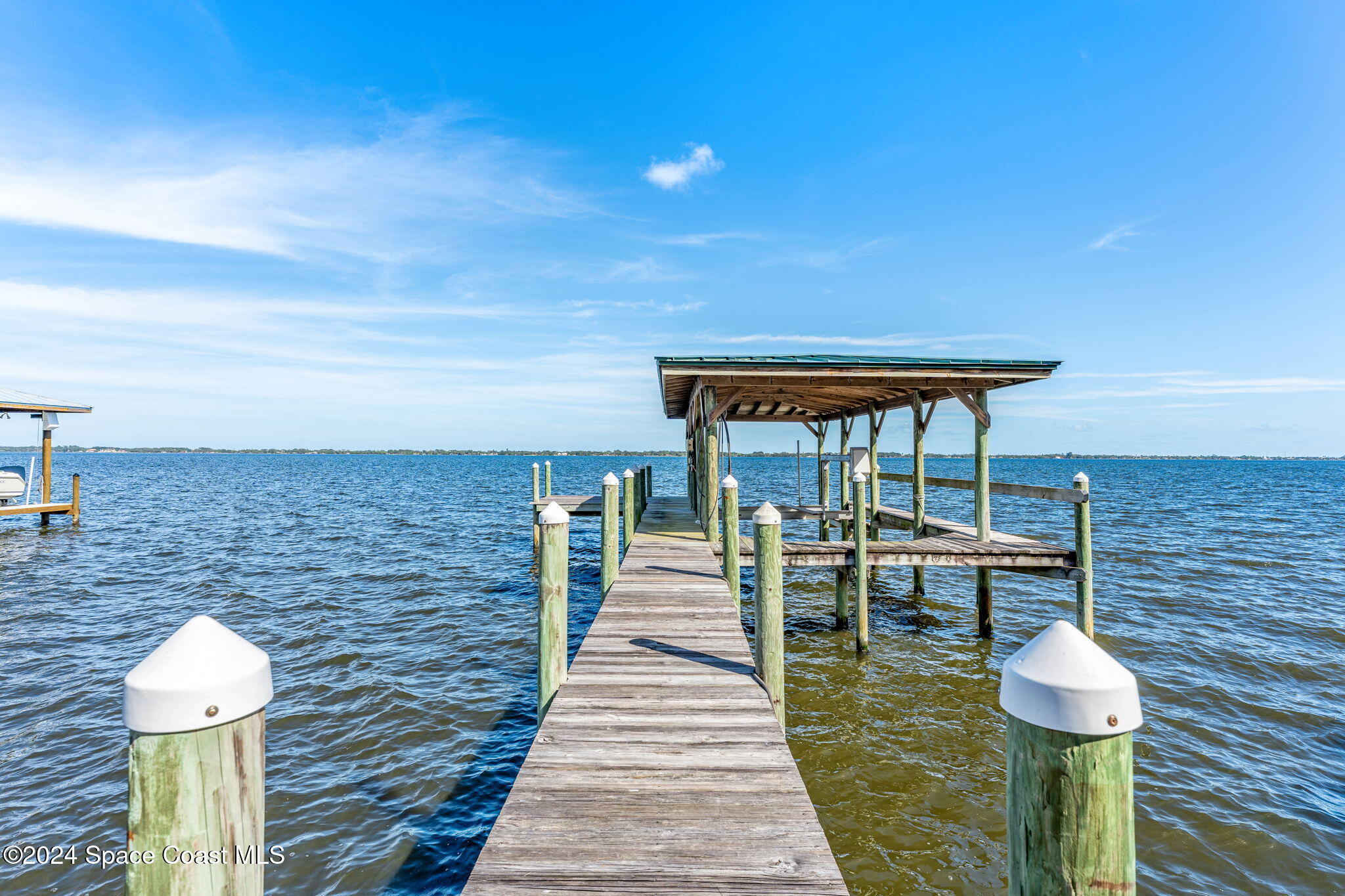 1600 Elm Drive West Melbourne, FL 32935 - Photo 60 of 79 a front view of a house with wooden floor and a table
