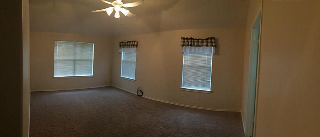2527 Liza Court Spring, TX 77388 - Photo 19 of 23 a view of a hallway with windows and chandelier