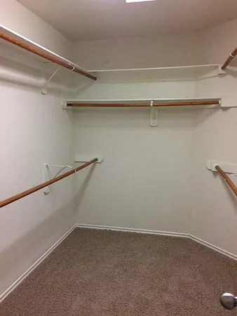 a view of an empty walk in closet