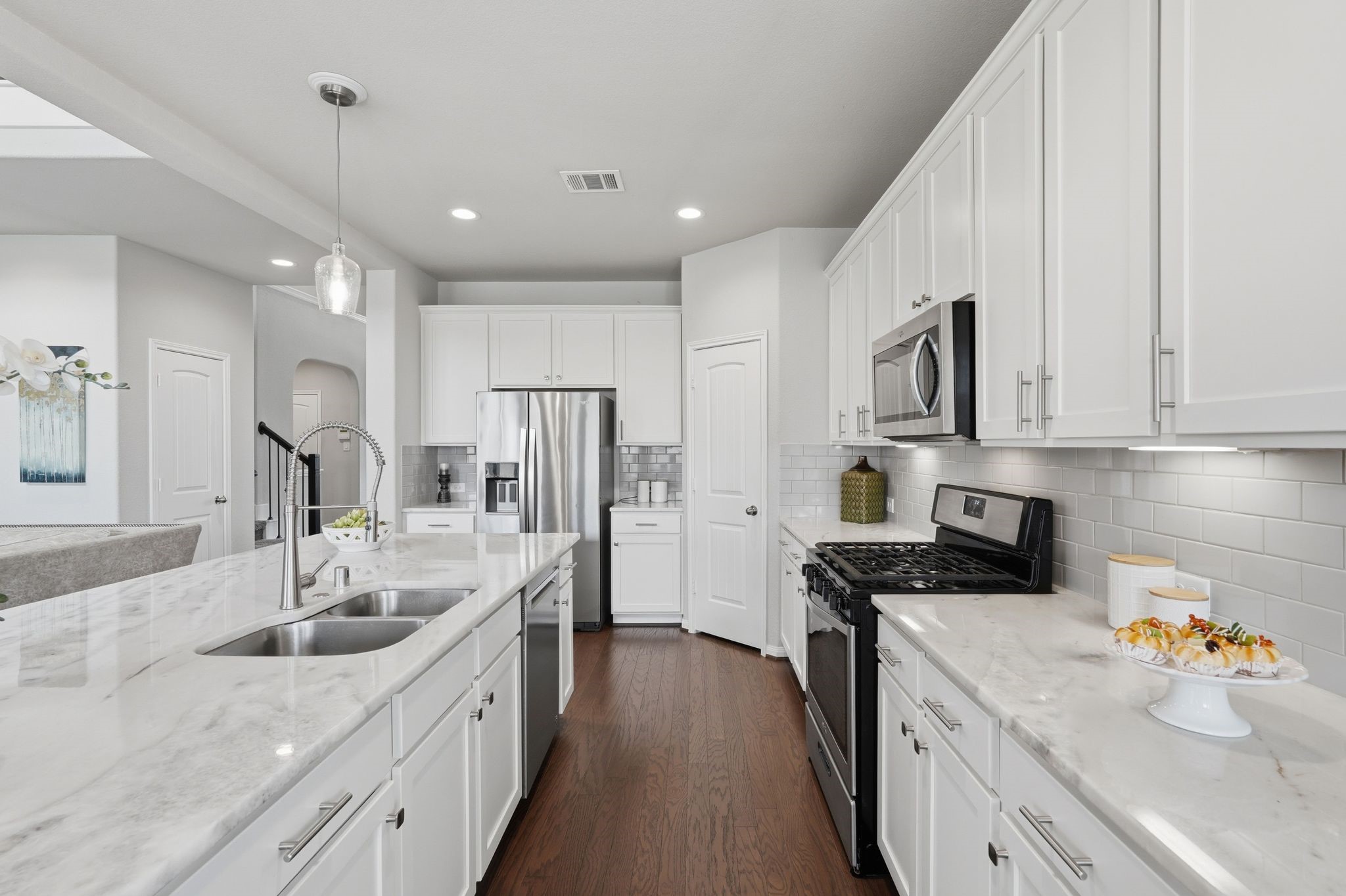 7522 Windsor View Drive Spring, TX 77379 - Photo 14 of 49 Open kitchen layout with generous prep space and room to gather.