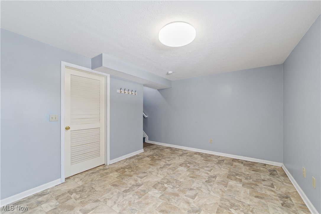 4364 Sexton Road Cleveland, OH 44105 - Photo 30 of 50 Additional living space with stone finish floors and stairway