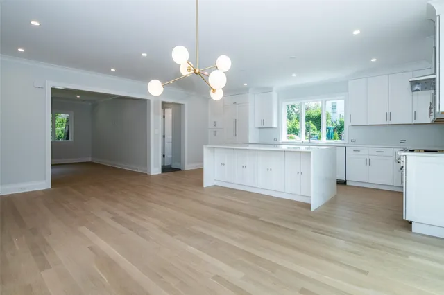 a view of a kitchen with a stove cabinets and wooden floor