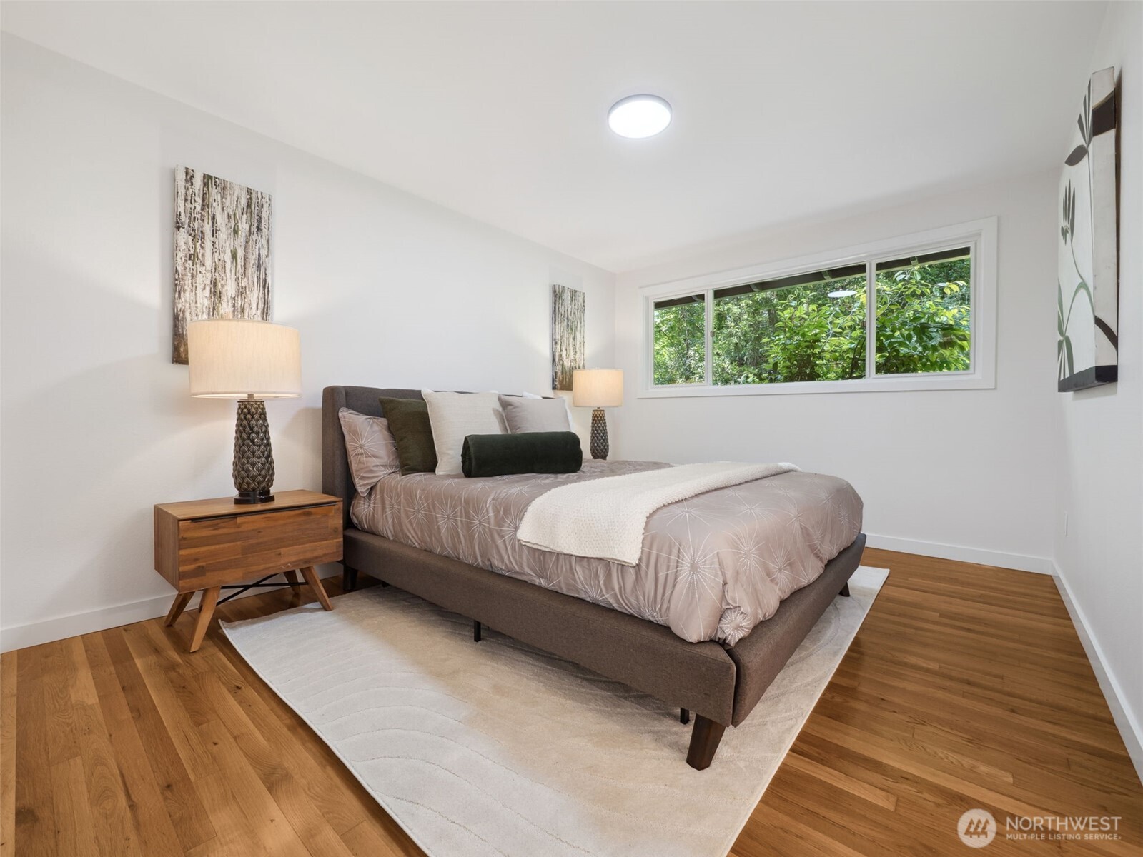 6423 East Mercer Way Mercer Island, WA 98040 - Photo 16 of 39 a bedroom with a bed and window