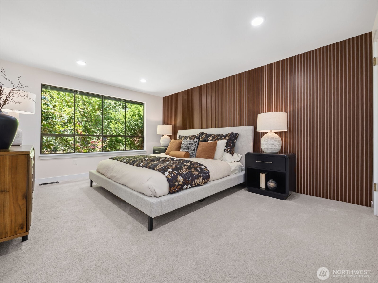 6423 East Mercer Way Mercer Island, WA 98040 - Photo 17 of 39 a bedroom with a bed and a large window