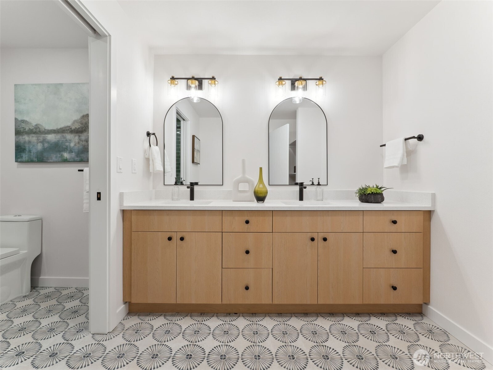 6423 East Mercer Way Mercer Island, WA 98040 - Photo 21 of 39 a bathroom with double sink and a mirror
