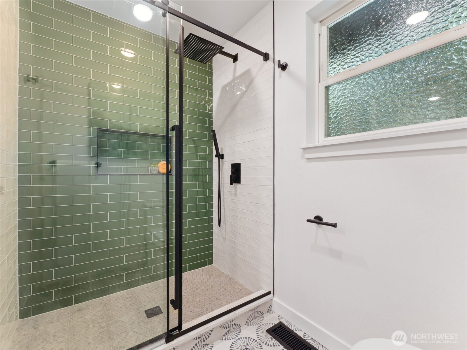 6423 East Mercer Way Mercer Island, WA 98040 - Photo 22 of 39 a bathroom with a glass shower door