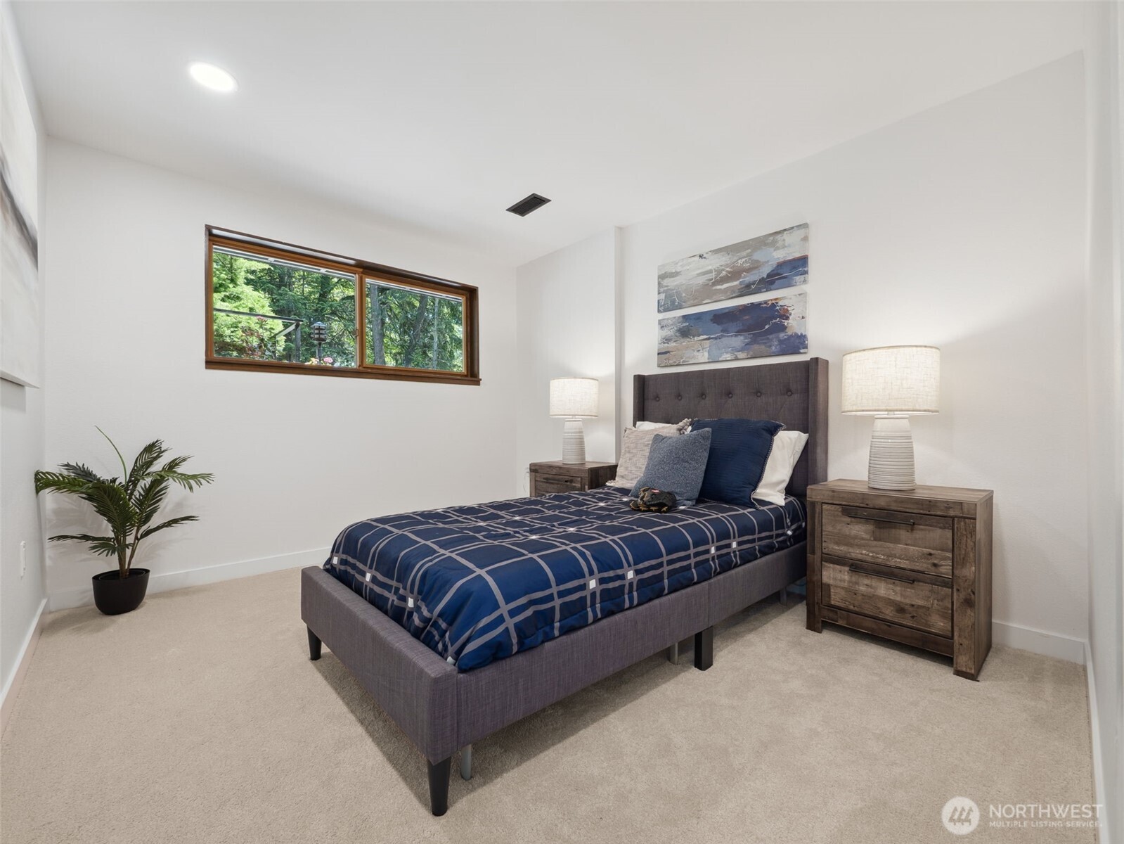 6423 East Mercer Way Mercer Island, WA 98040 - Photo 30 of 39 a bedroom with a bed and a couch