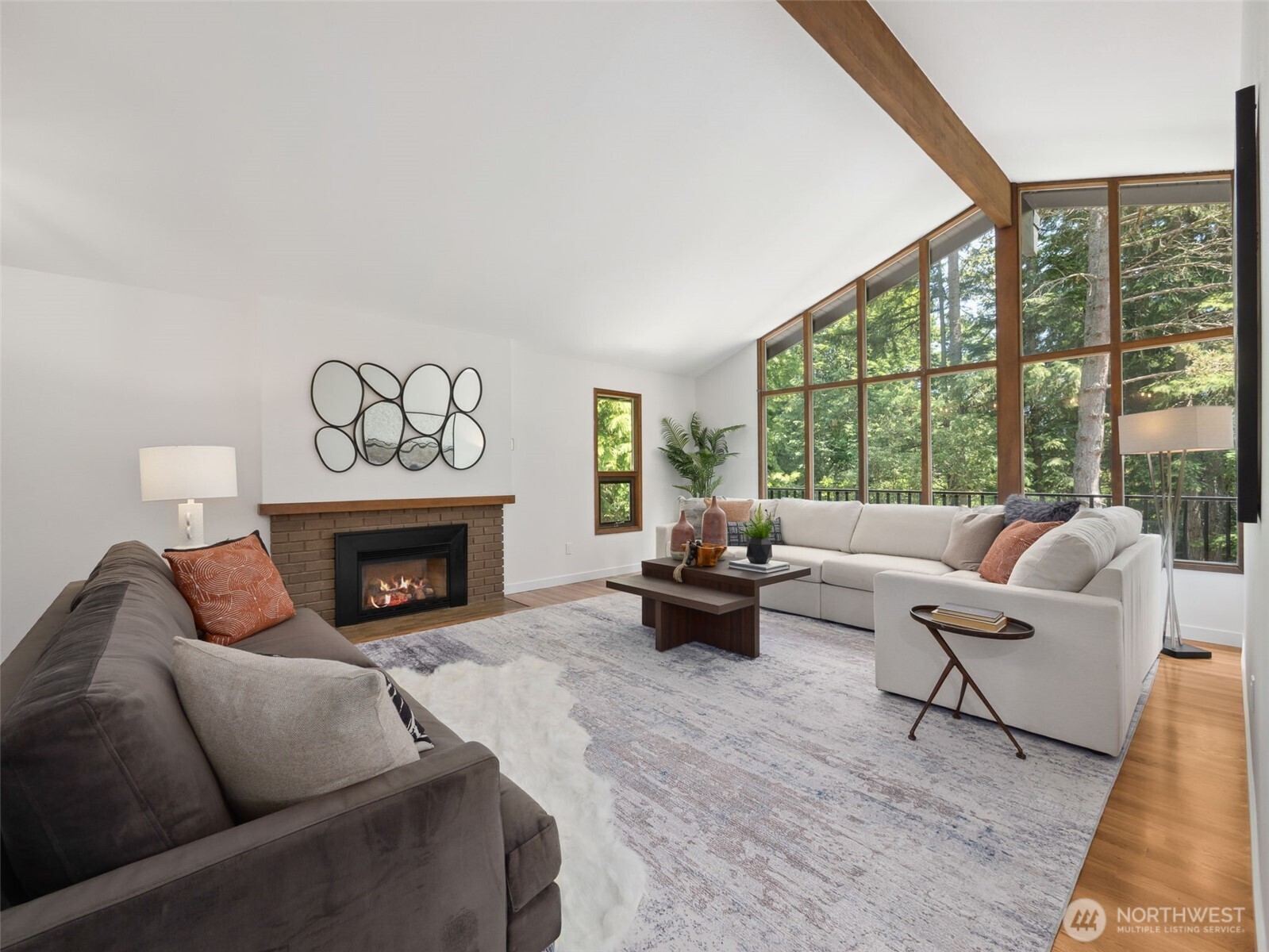 6423 East Mercer Way Mercer Island, WA 98040 - Photo 5 of 39 a living room with furniture and a fireplace