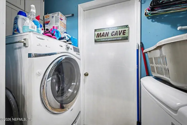 a utility room with dryer and washer