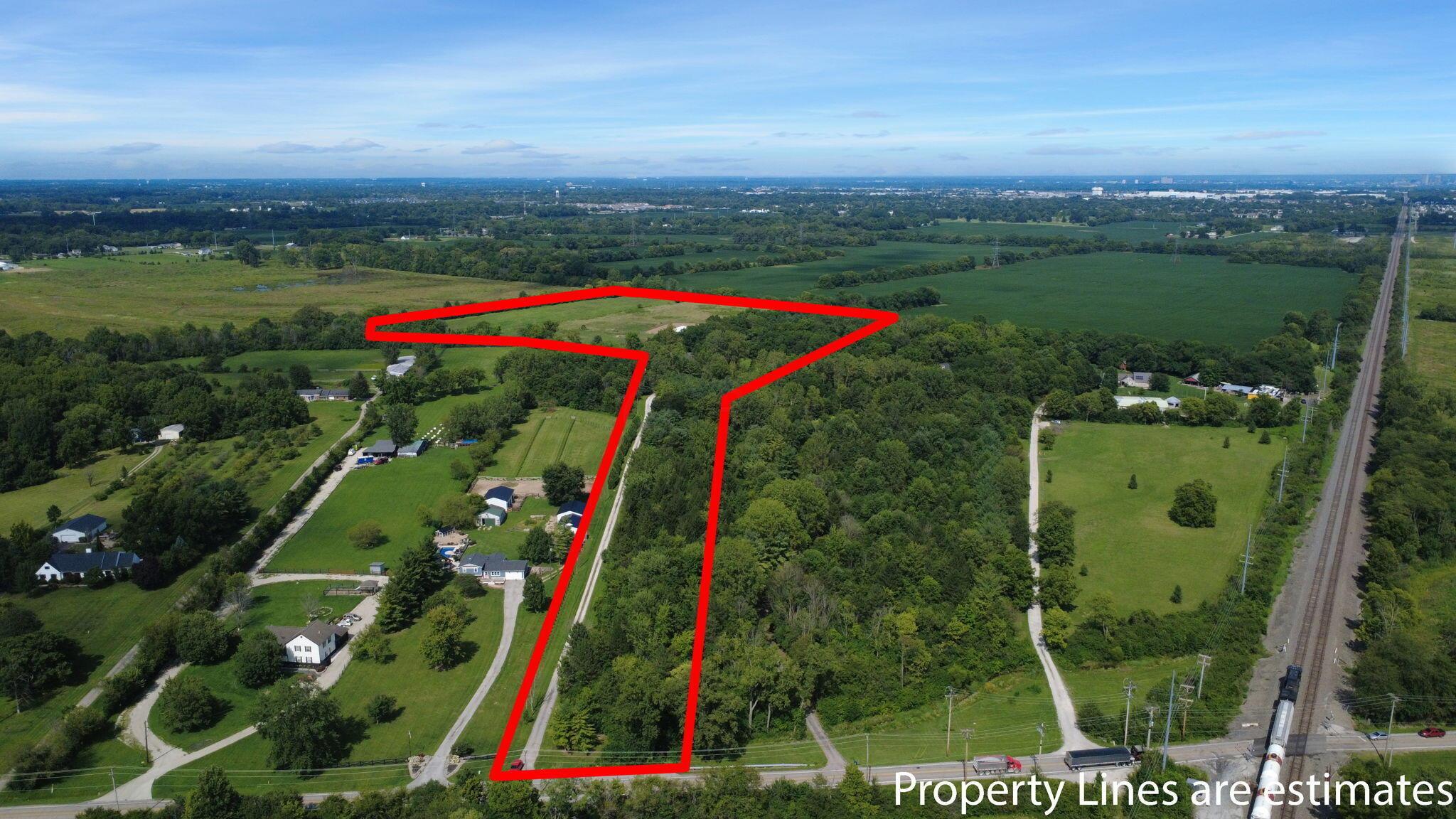 548 Amity Road Galloway, OH 43119 - Photo 62 of 75 Expansive land parcel featuring wooded areas and open fields
