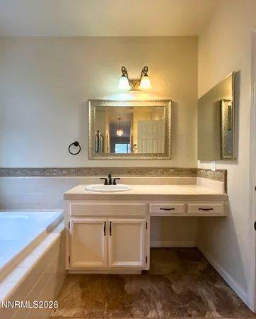 a view with a sink and a mirror