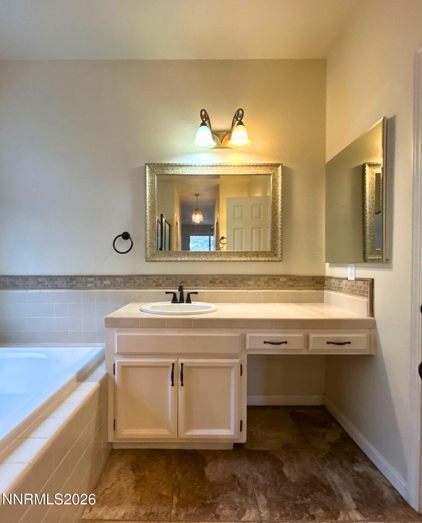 9535 Comanche Moon Drive Reno, NV 89521 - Photo 12 of 20 a view with a sink and a mirror
