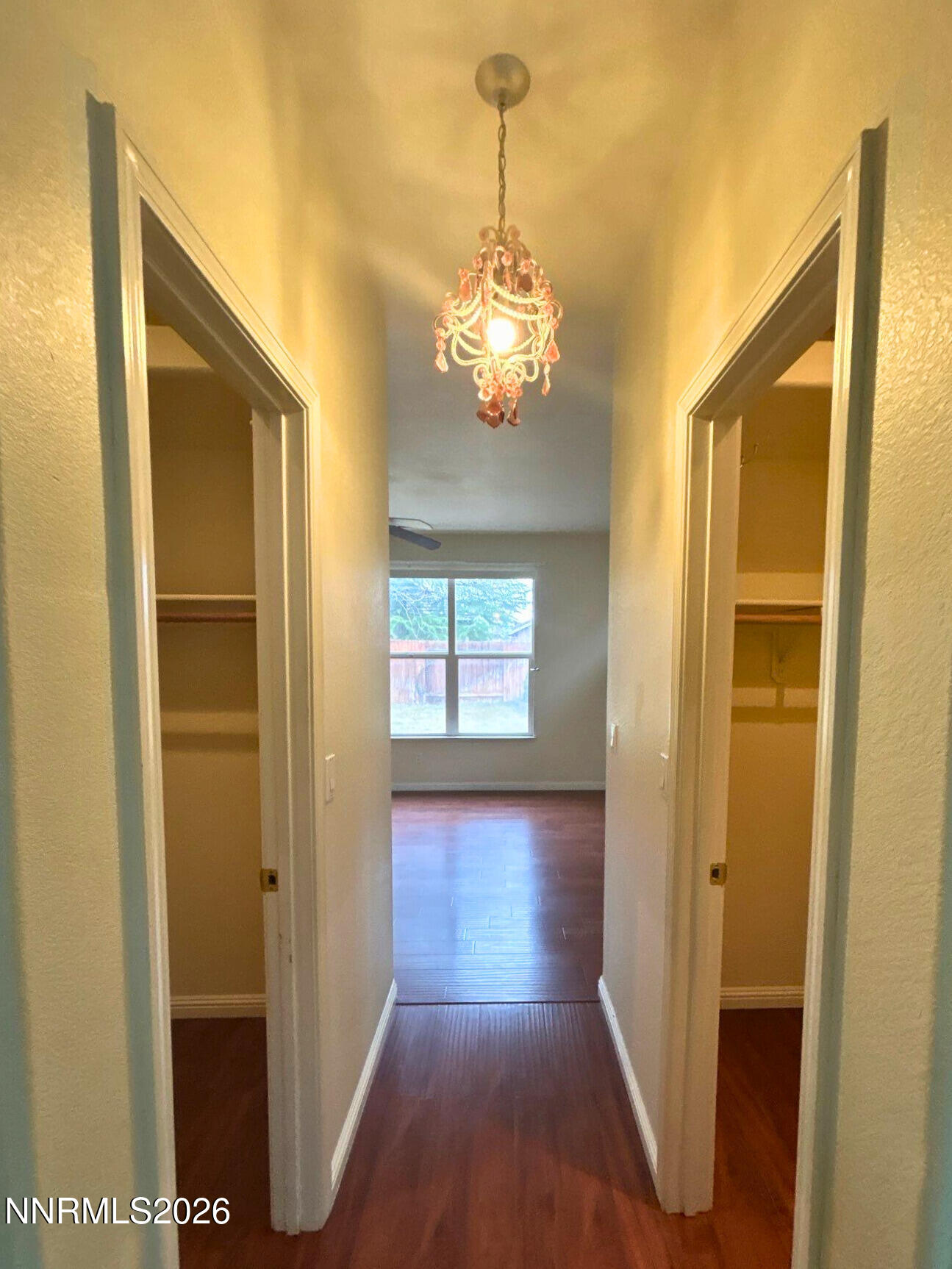 9535 Comanche Moon Drive Reno, NV 89521 - Photo 14 of 20 a view of a hallway with wooden floor and a dining room