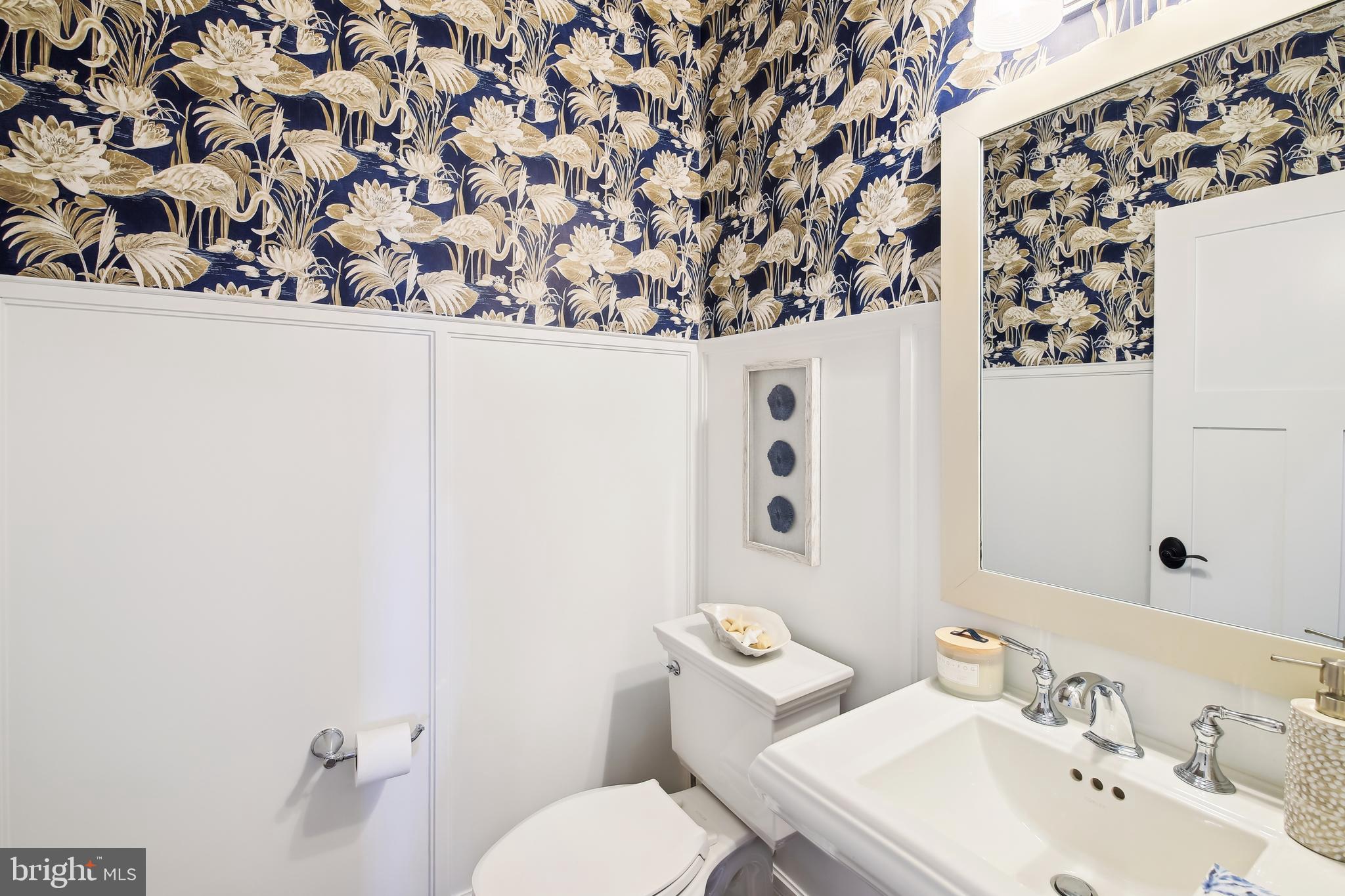 32841 Widgeon Road, Unit 10 Ocean View, DE 19970 - Photo 31 of 99 Powder room w/pedestal sink, wainscoting on walls