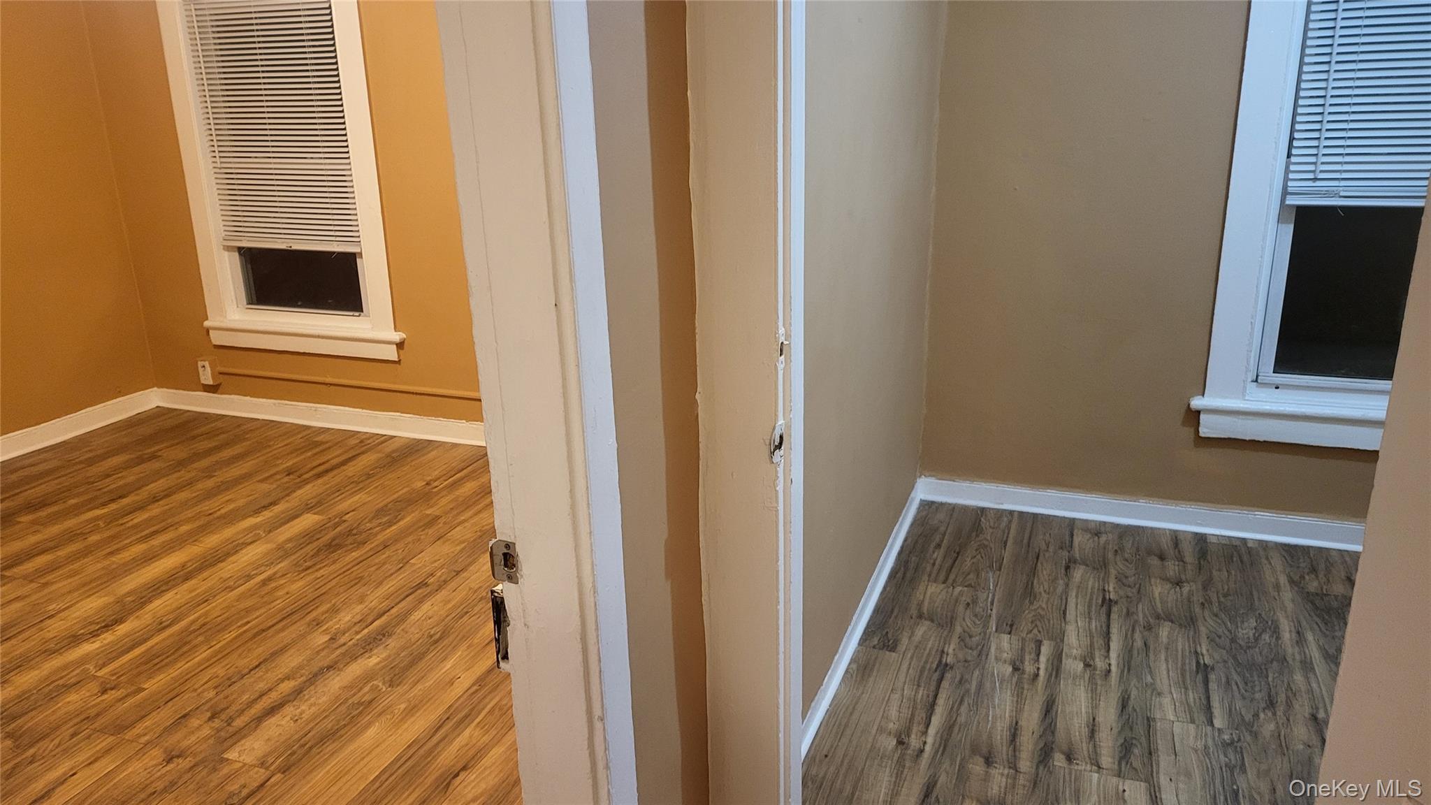 92 Academy Street Poughkeepsie, NY 12601 - Photo 17 of 28 a view of a room with wooden floor and a flat screen tv