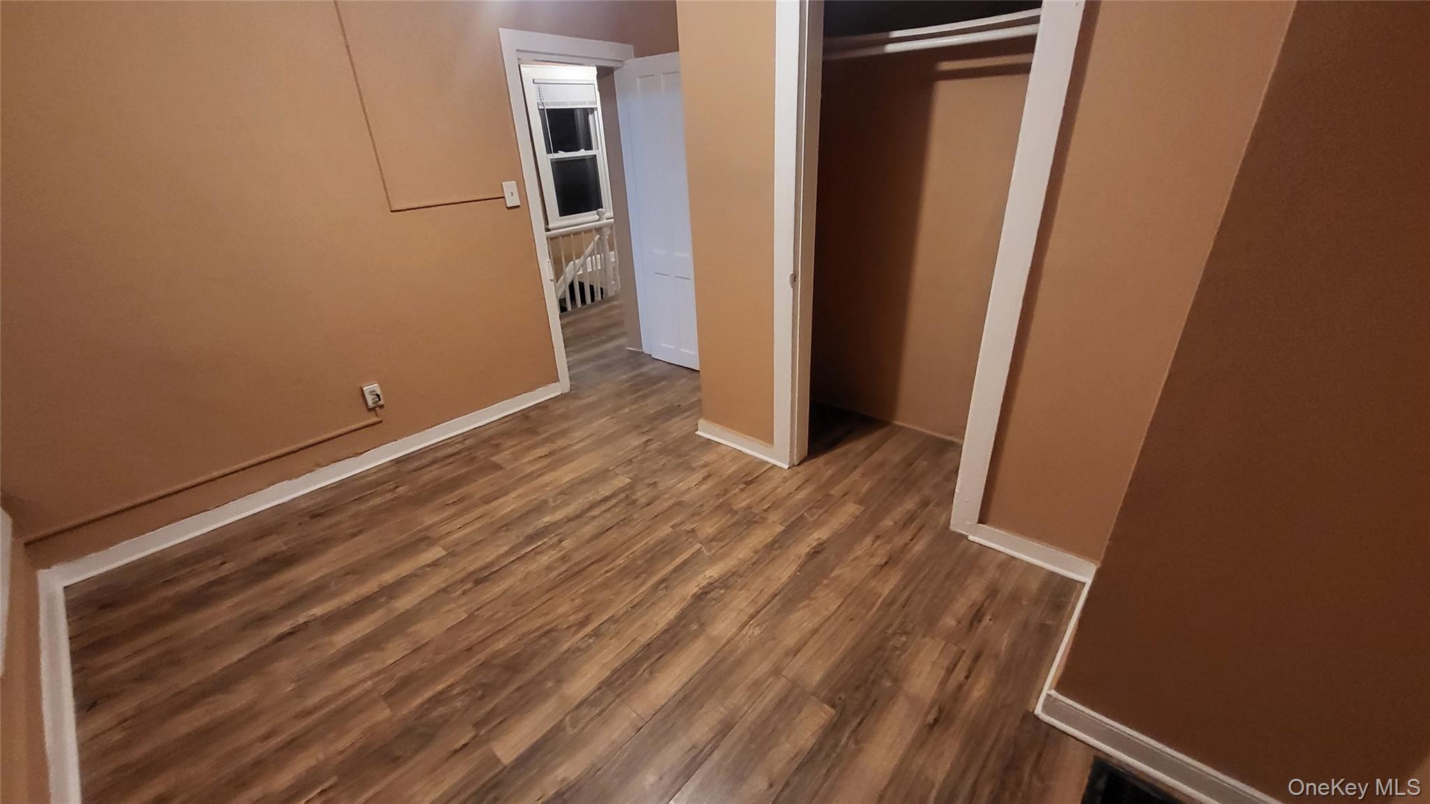 92 Academy Street Poughkeepsie, NY 12601 - Photo 27 of 28 an empty room with wooden floor and entrance