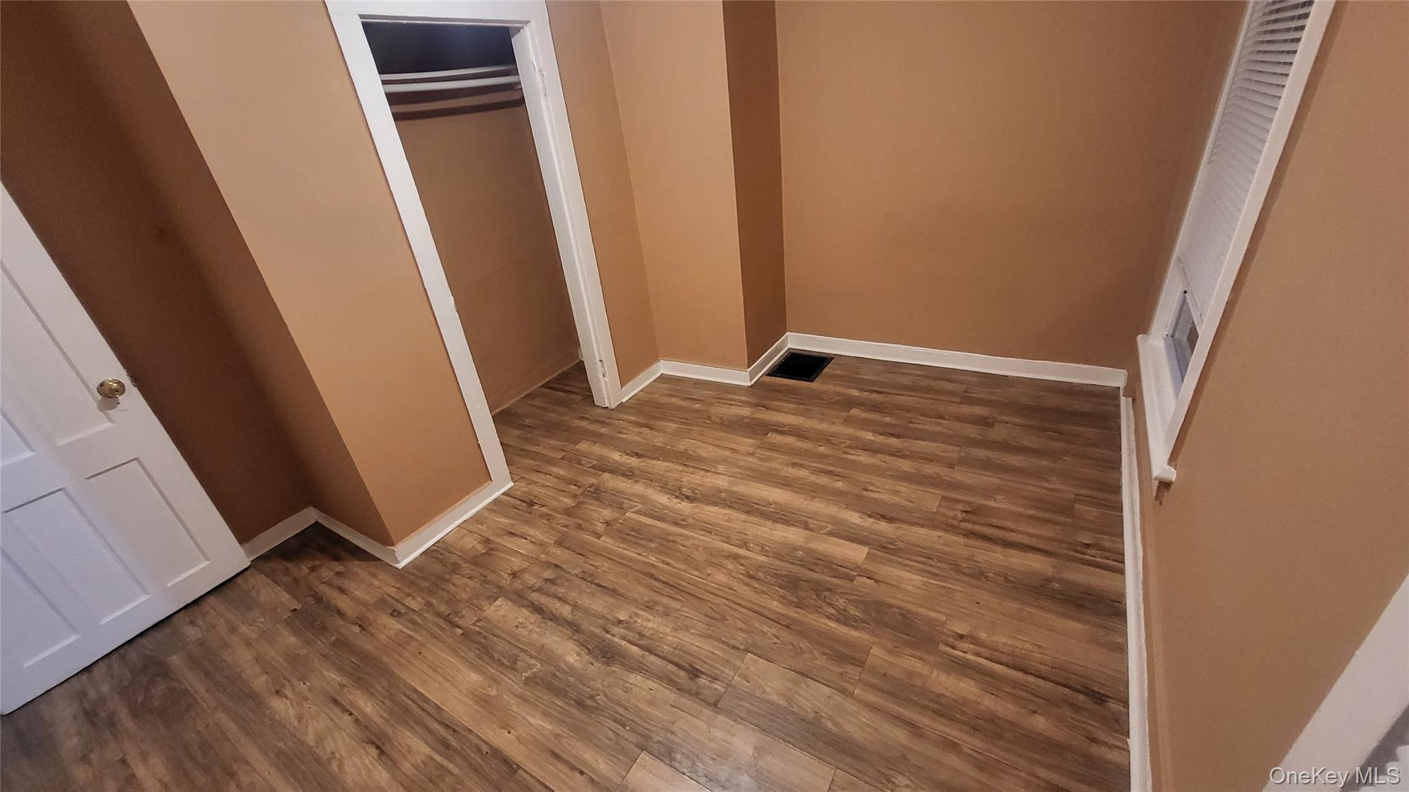 92 Academy Street Poughkeepsie, NY 12601 - Photo 28 of 28 a view of a room with wooden floor and sliding door