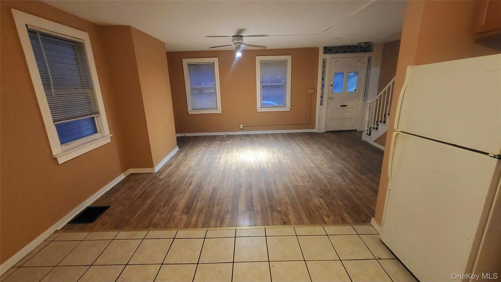 92 Academy Street Poughkeepsie, NY 12601 - Photo 5 of 28 a view of an empty room with window and wooden floor