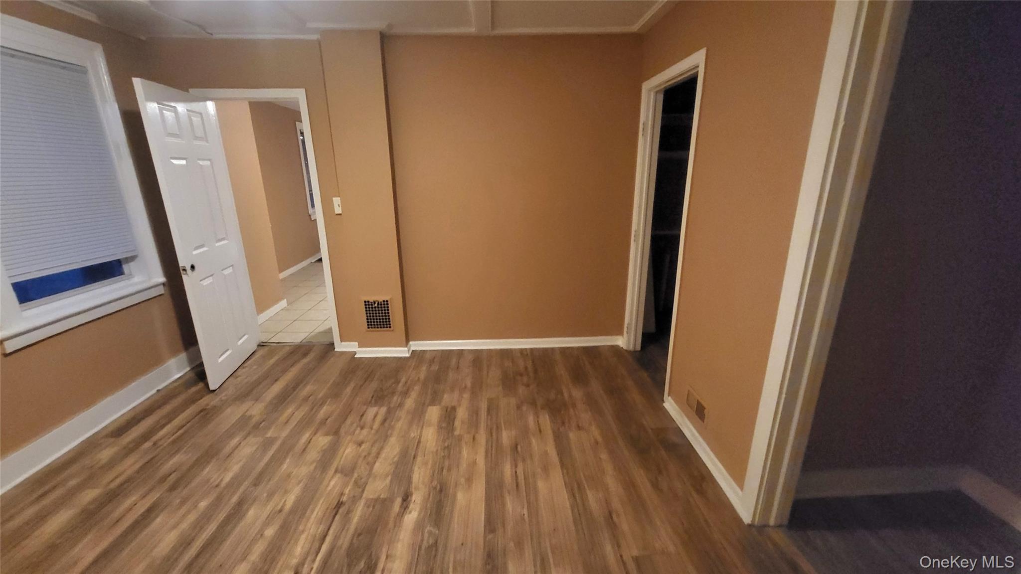 92 Academy Street Poughkeepsie, NY 12601 - Photo 9 of 28 a view of front door with wooden floor