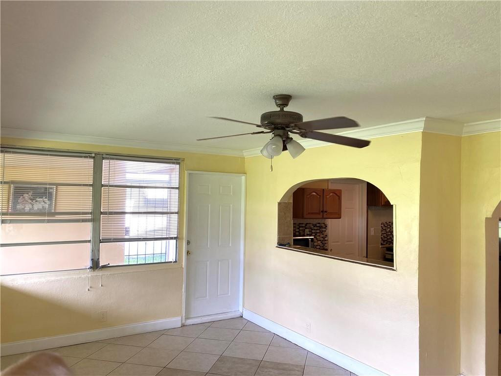 5019 Northwest 49th Road Tamarac, FL 33319 - Photo 12 of 25 a view of a livingroom with a staircase
