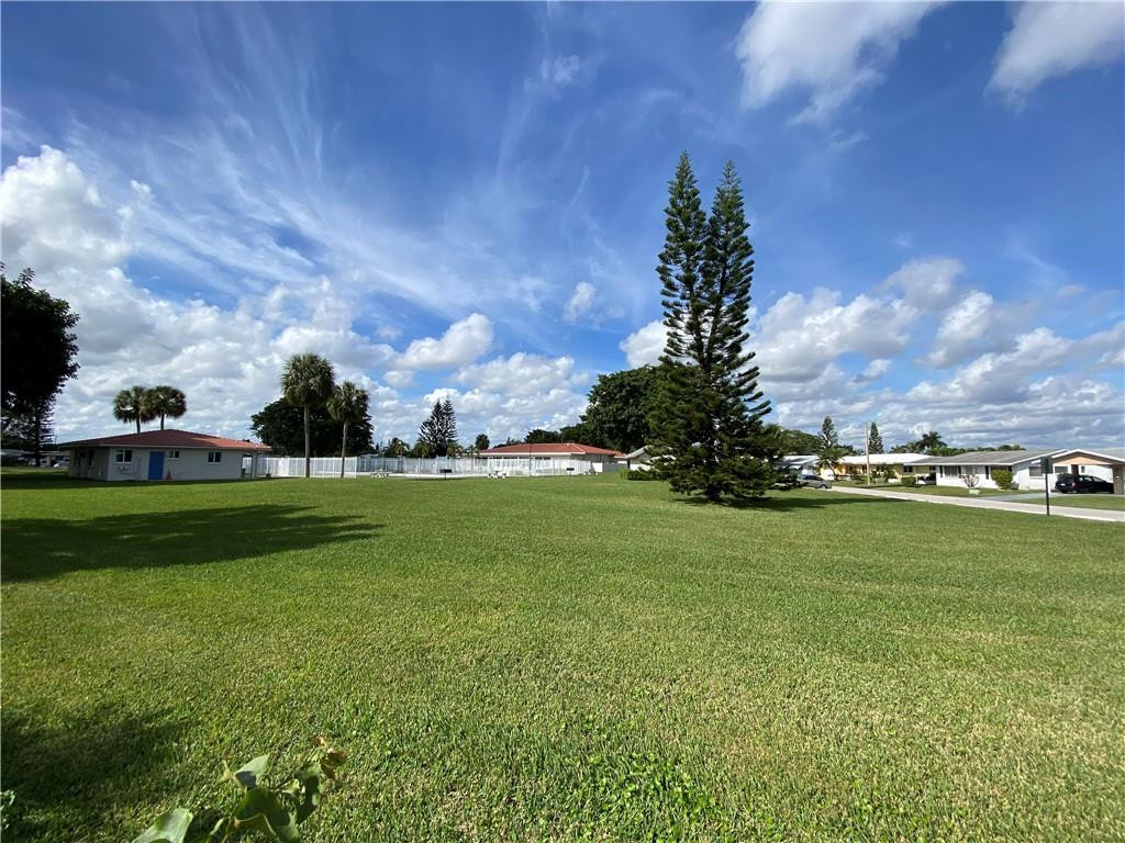 5019 Northwest 49th Road Tamarac, FL 33319 - Photo 24 of 25 a view of a golf course with a lake