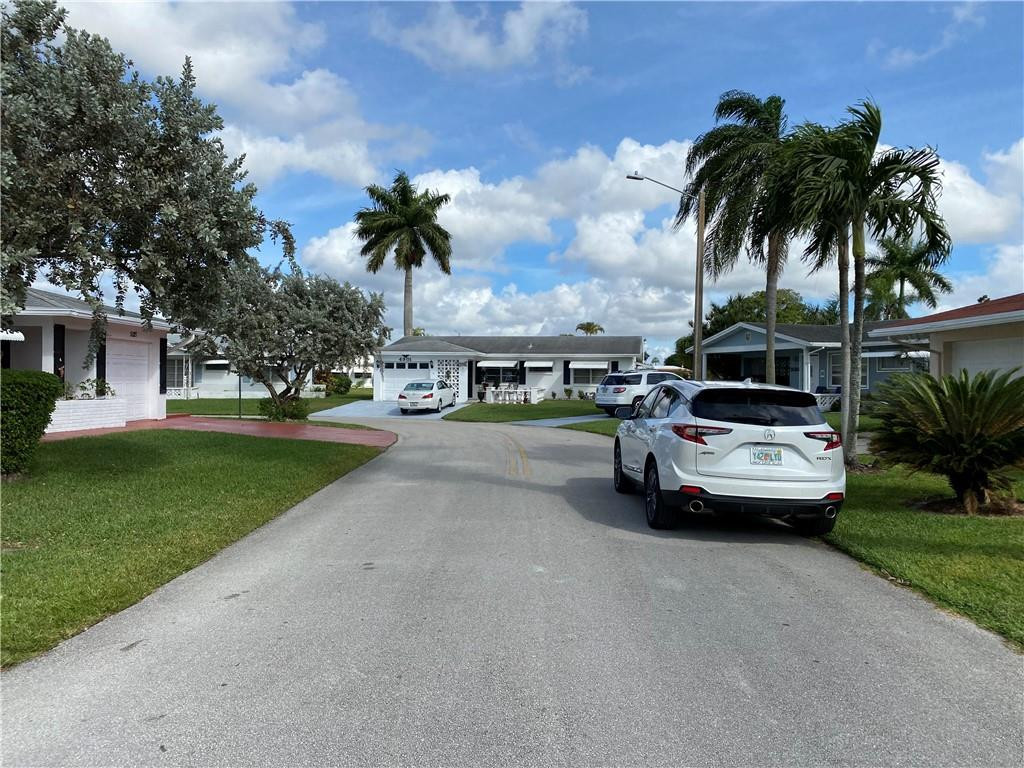 5019 Northwest 49th Road Tamarac, FL 33319 - Photo 25 of 25 a view of street with parked cars