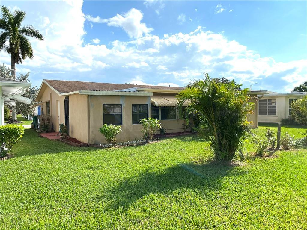 5019 Northwest 49th Road Tamarac, FL 33319 - Photo 5 of 25 a view of a house with a backyard