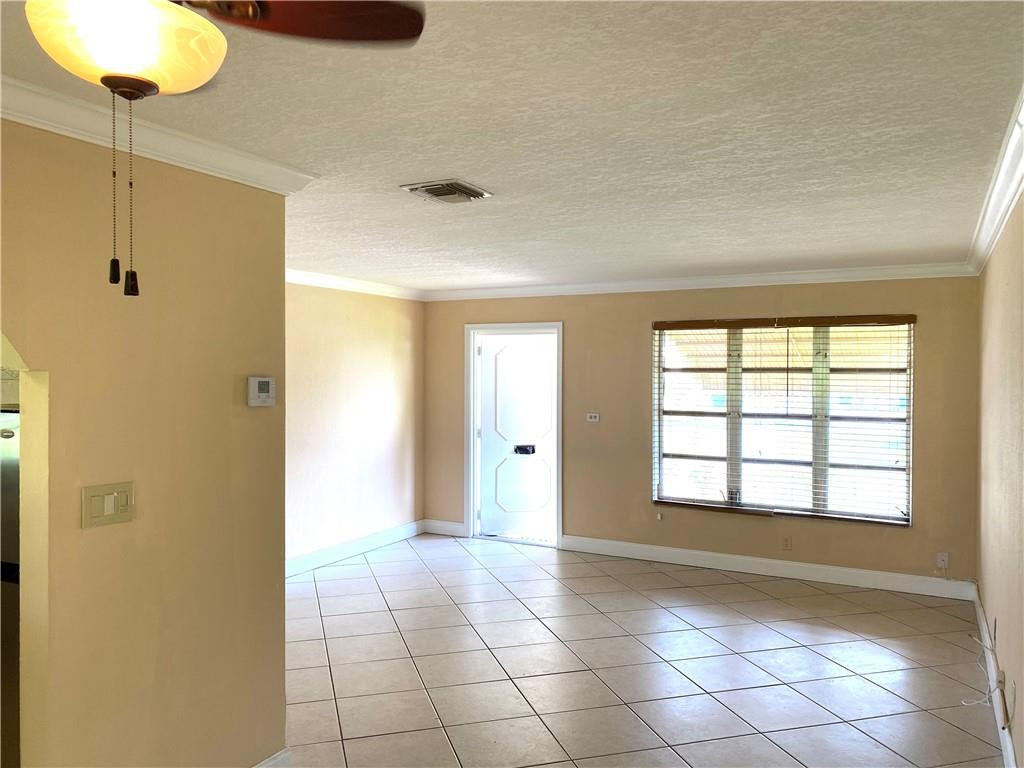 5019 Northwest 49th Road Tamarac, FL 33319 - Photo 8 of 25 a view of an empty room and window