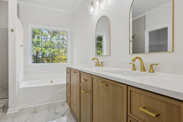 an empty room with a window and a ceiling fan